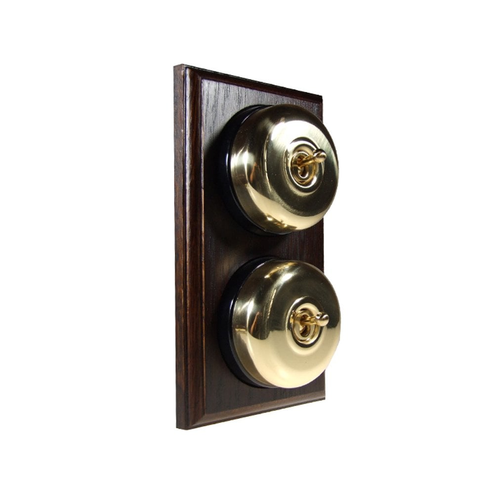 Switch to Wood's Dolly Light Switch Smooth Dome - 2 Gang Vertical Polished Brass in Dark Oak