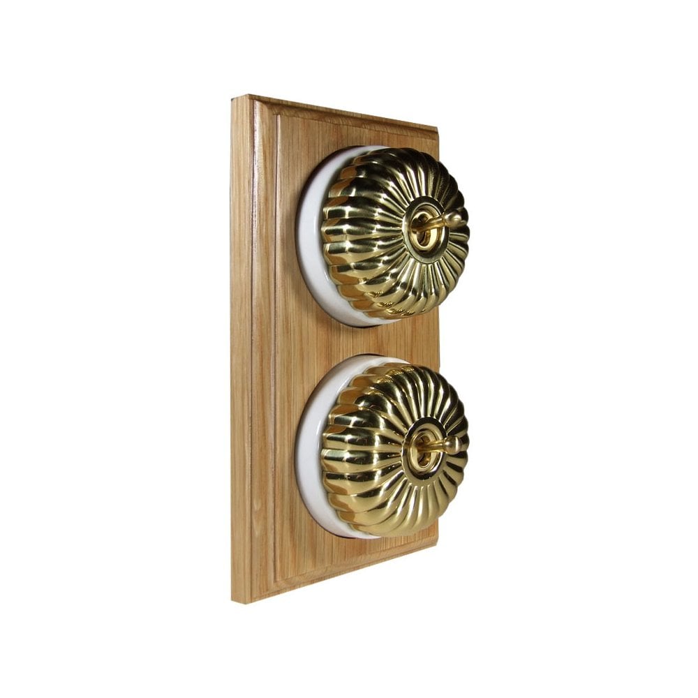 Switch to Wood's Dolly Light Switch Fluted Dome - 2 Gang Vertical Polished Brass in Light Oak