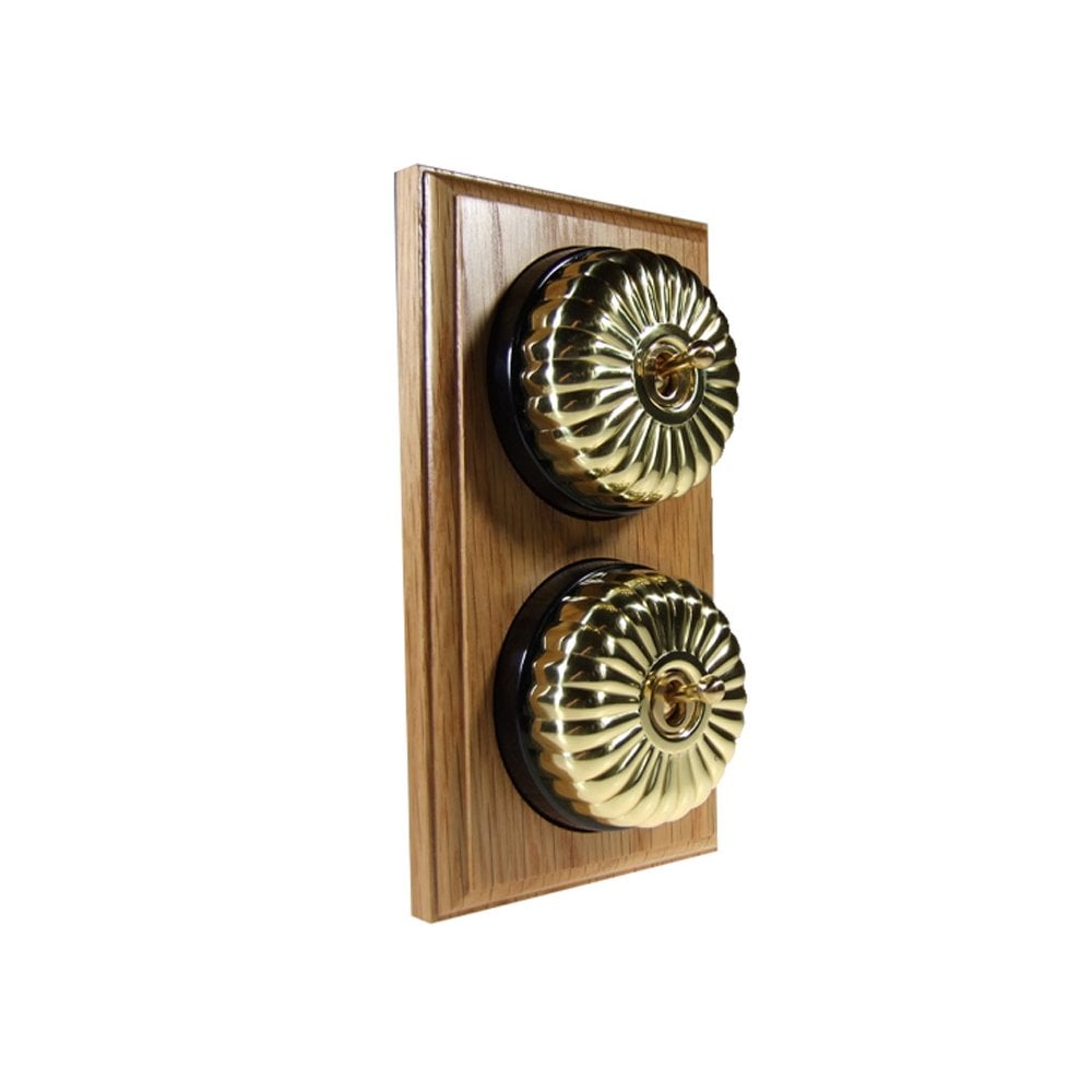 Switch to Wood's Dolly Light Switch Fluted Dome - 2 Gang Vertical Polished Brass in Light Oak