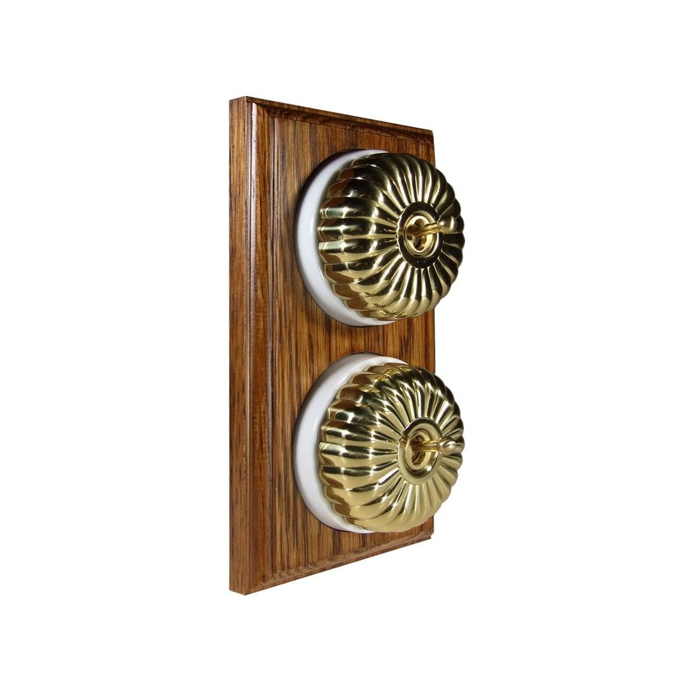 Switch to Wood's Dolly Light Switch Fluted Dome - 2 Gang Vertical Polished Brass in Medium Oak 