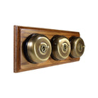 Switch to Wood's Dolly Light Switch Smooth Dome - 3 Gang Horizontal Antique Brass in Medium Oak 