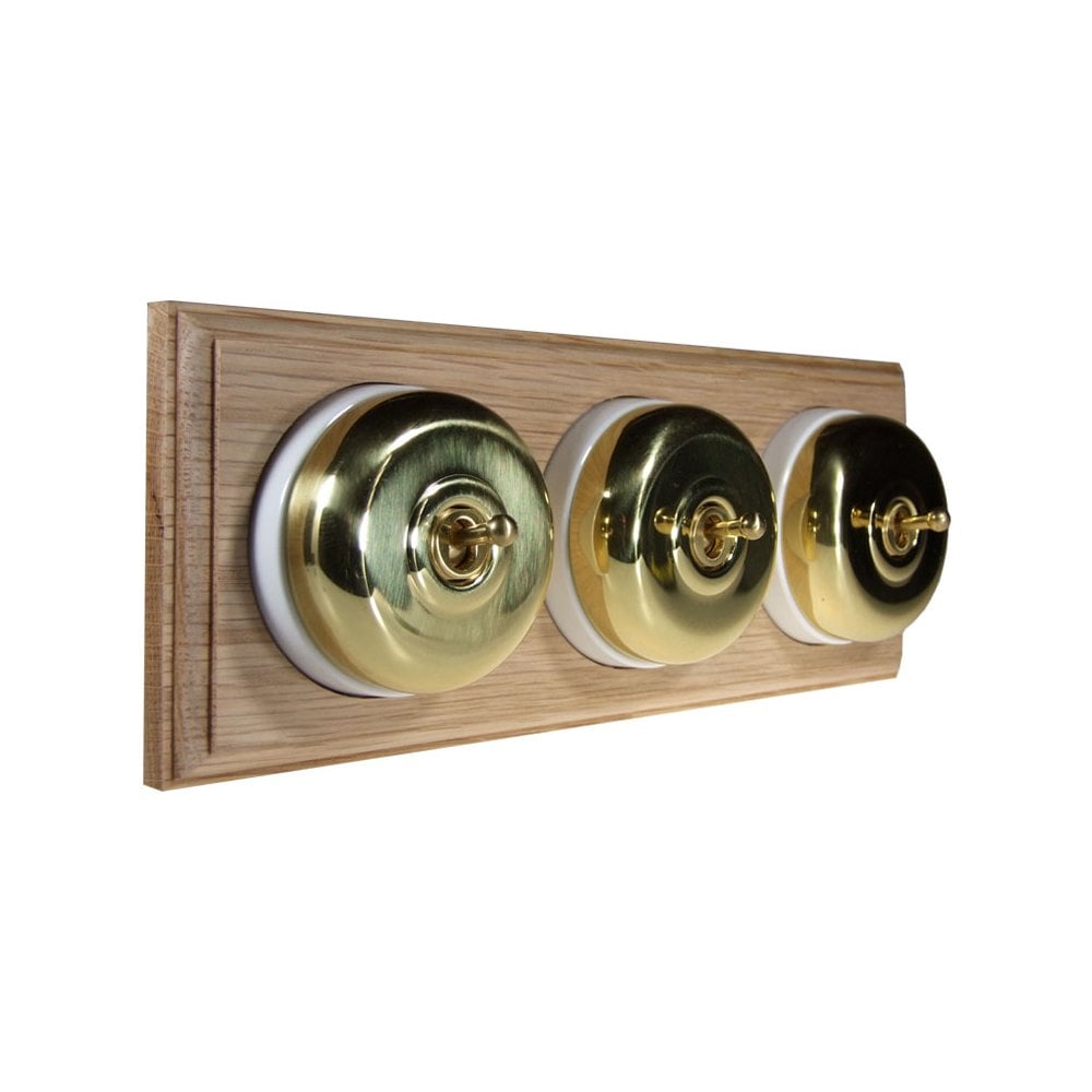 Switch to Wood's Dolly Light Switch Smooth Dome - 3 Gang Horizontal Polished Brass in Unfinished Oak