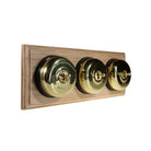 Switch to Wood's Dolly Light Switch Smooth Dome - 3 Gang Horizontal Polished Brass in Unfinished Oak