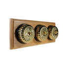 Switch to Wood's Dolly Light Switch Fluted Dome - 3 Gang Horizontal Polished Brass in Light Oak