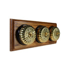 Switch to Wood's Dolly Light Switch Fluted Dome - 3 Gang Horizontal Polished Brass in Medium Oak 