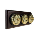 Switch to Wood's Dolly Light Switch Fluted Dome - 3 Gang Horizontal Polished Brass in Dark Oak