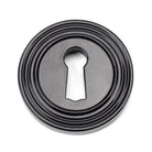 From The Anvil's Black Round Escutcheon