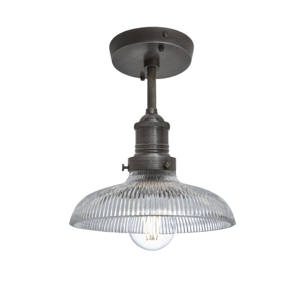 Industrial-style pendant light with a glass dome with a pewter holder.
