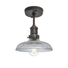 Industrial-style pendant light with a glass dome with a pewter holder.