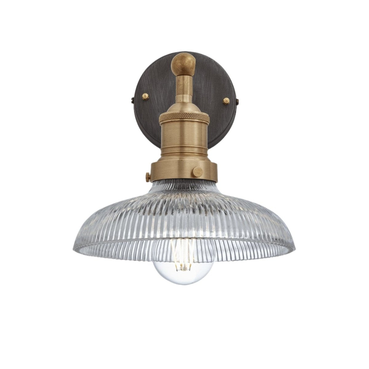 Industrial-style pendant light with a glass dome with a brass holder.
