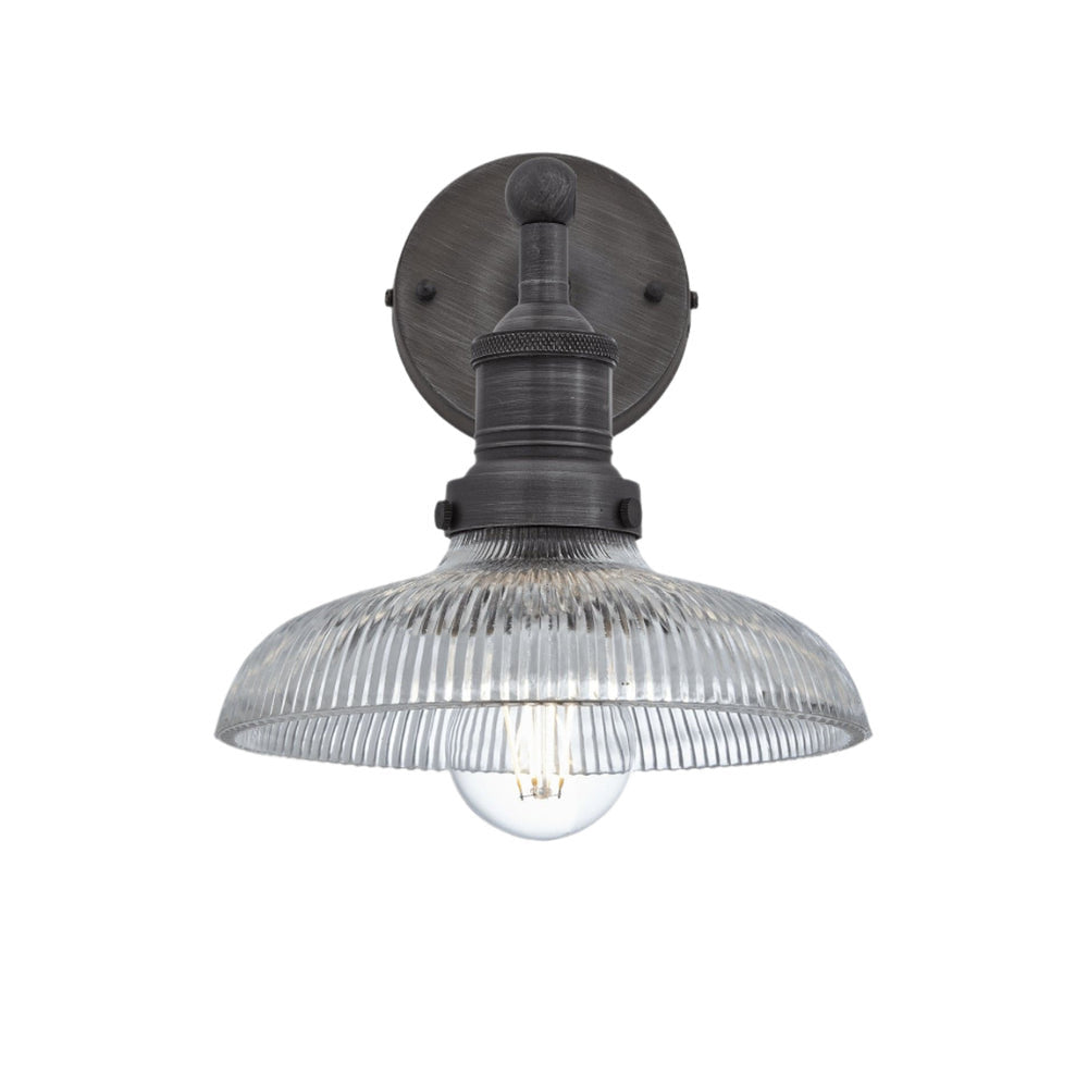 Industrial-style pendant light with a glass dome with a pewter holder.