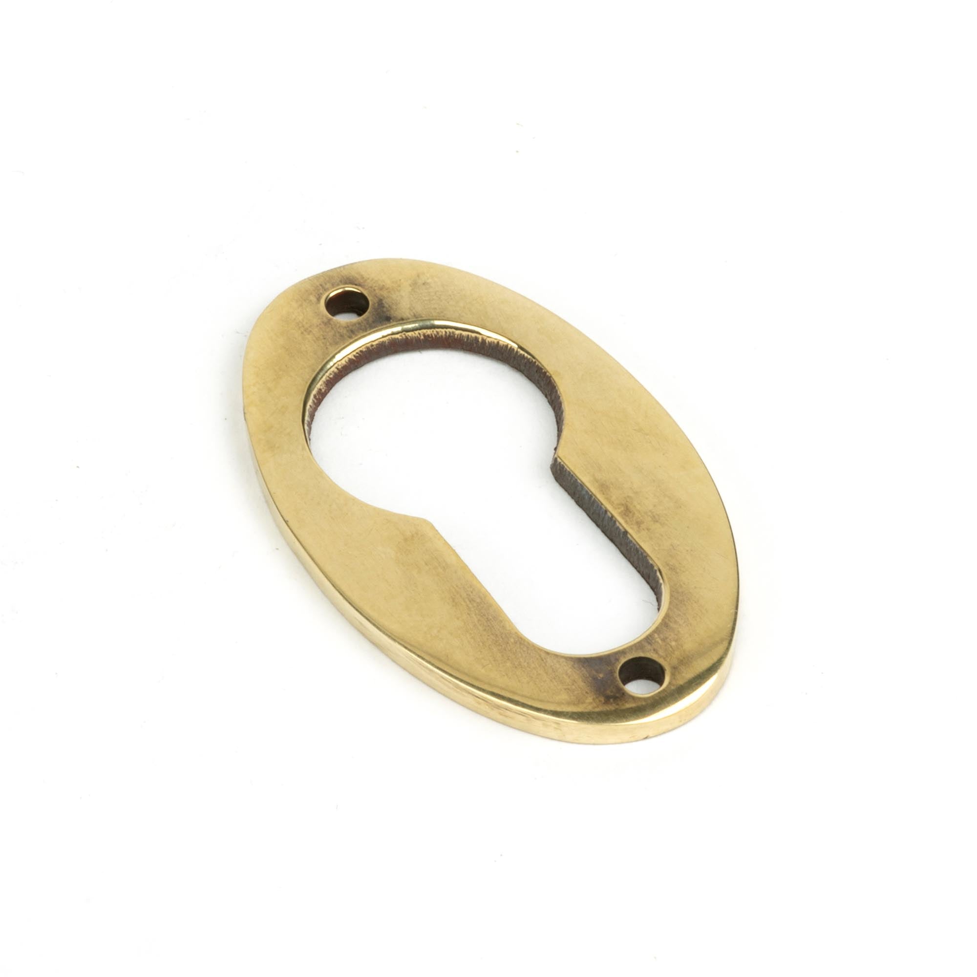 From The Anvil's Aged Brass Oval Euro Esctucheon