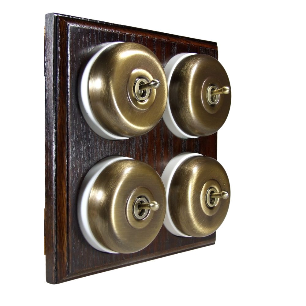 Switch to Wood's Dolly Light Switch Smooth Dome - 4 Gang Horizontal Antique Brass in Dark Oak