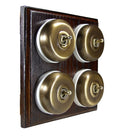Switch to Wood's Dolly Light Switch Smooth Dome - 4 Gang Horizontal Antique Brass in Dark Oak