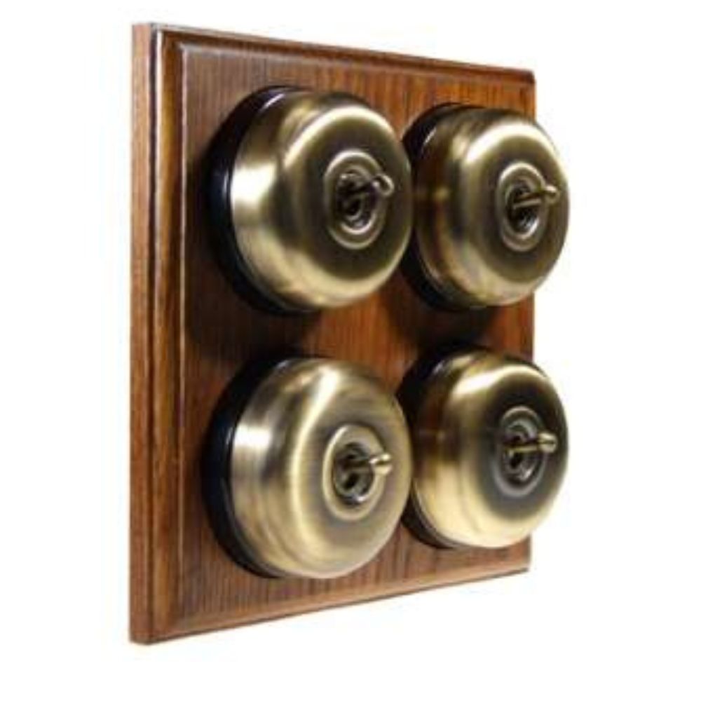 Switch to Wood's Dolly Light Switch Smooth Dome - 4 Gang Horizontal Antique Brass in Medium Oak 