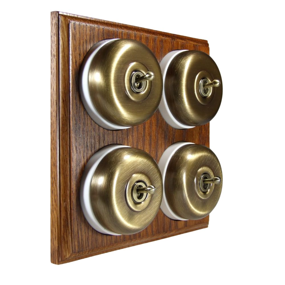 Switch to Wood's Dolly Light Switch Smooth Dome - 4 Gang Horizontal Antique Brass in Medium Oak 