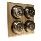 Switch to Wood's Dolly Light Switch Smooth Dome - 4 Gang Horizontal Antique Brass in Light Oak