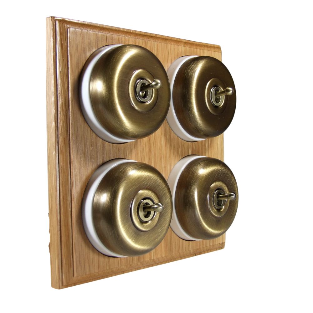 Switch to Wood's Dolly Light Switch Smooth Dome - 4 Gang Horizontal Antique Brass in Light Oak