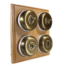 Switch to Wood's Dolly Light Switch Smooth Dome - 4 Gang Horizontal Antique Brass in Light Oak