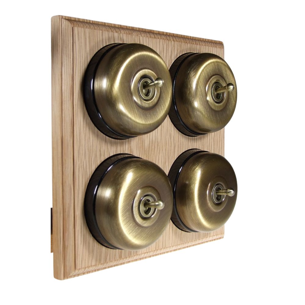 Switch to Wood's Dolly Light Switch Smooth Dome - 4 Gang Horizontal Antique Brass in Unfinished Oak