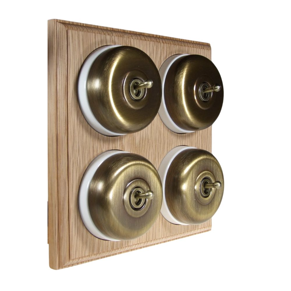 Switch to Wood's Dolly Light Switch Smooth Dome - 4 Gang Horizontal Antique Brass in Unfinished Oak
