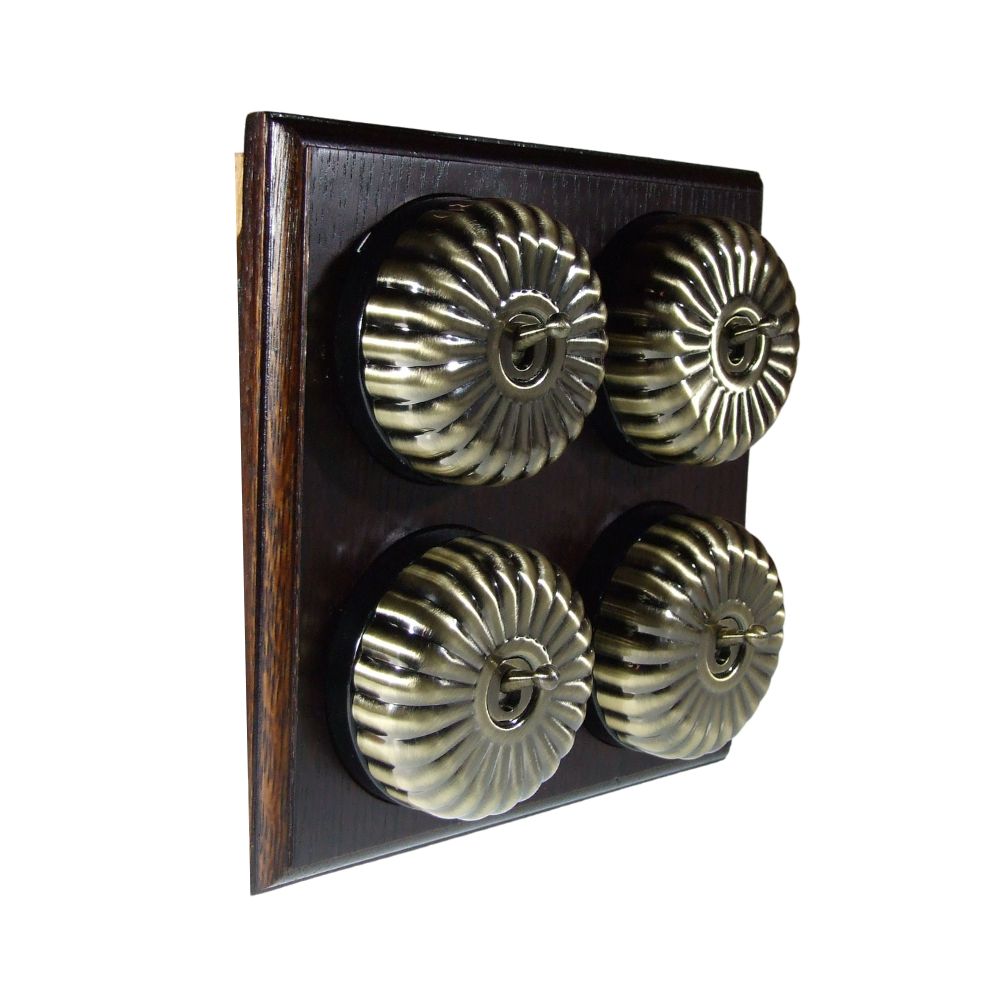 Switch to Wood's Dolly Light Switch Fluted Dome - 4 Gang Horizontal Antique Brass in Dark Oak