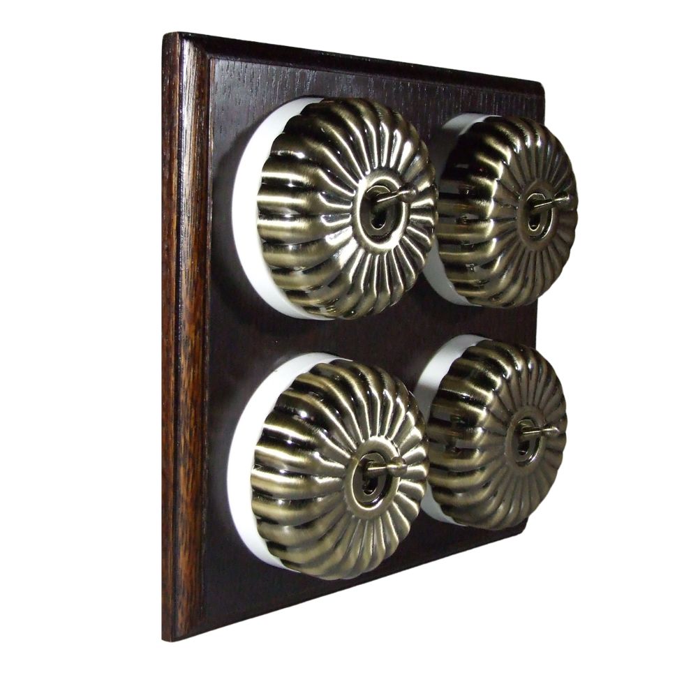 Switch to Wood's Dolly Light Switch Fluted Dome - 4 Gang Horizontal Antique Brass in Dark Oak