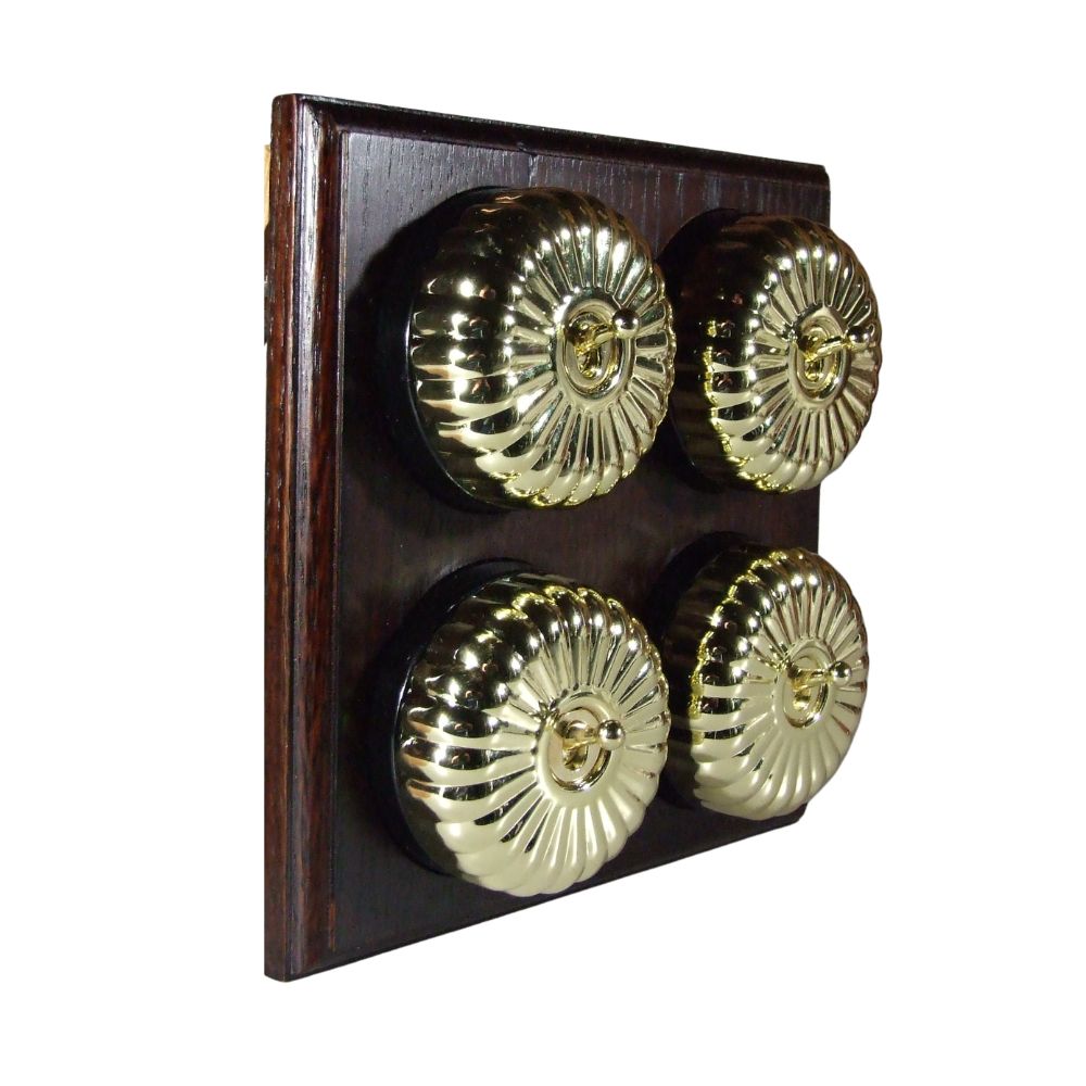 Switch to Wood's Dolly Light Switch Fluted Dome - 4 Gang Horizontal Polished Brass in Dark Oak