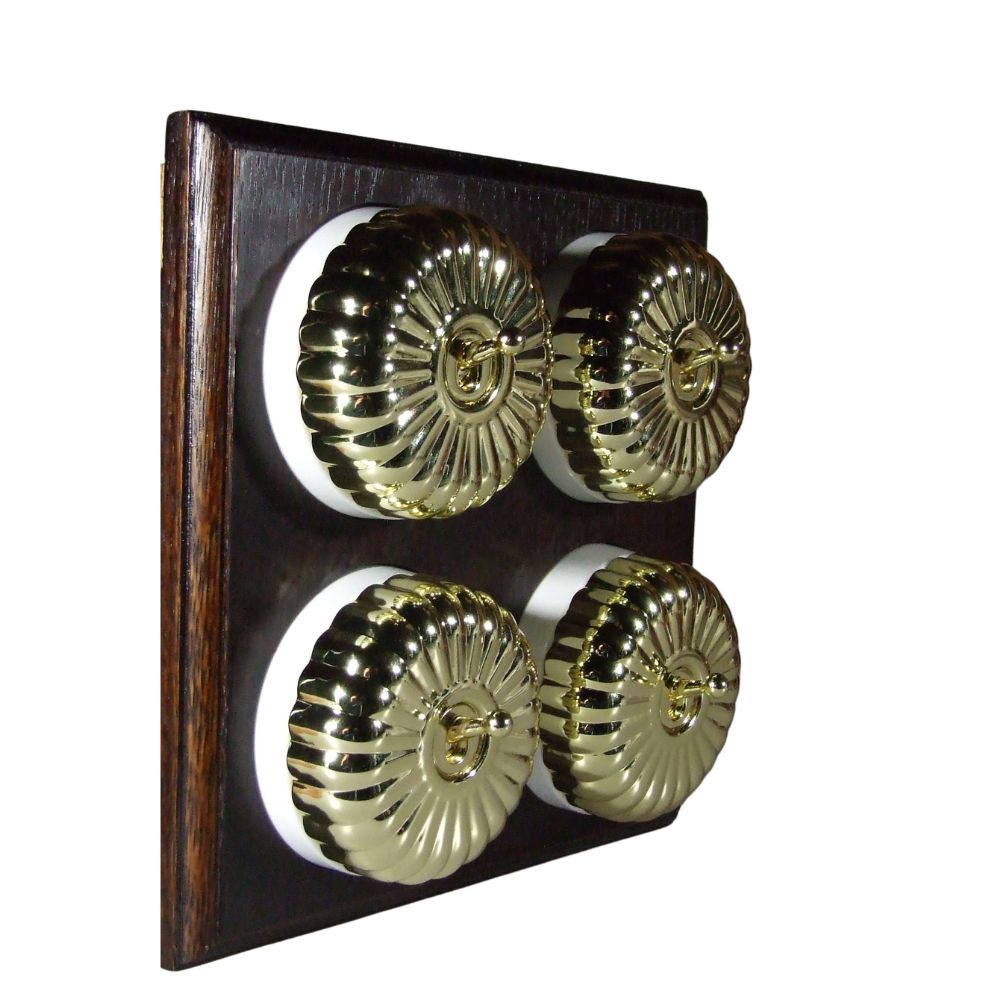 Switch to Wood's Dolly Light Switch Fluted Dome - 4 Gang Horizontal Polished Brass in Dark Oak