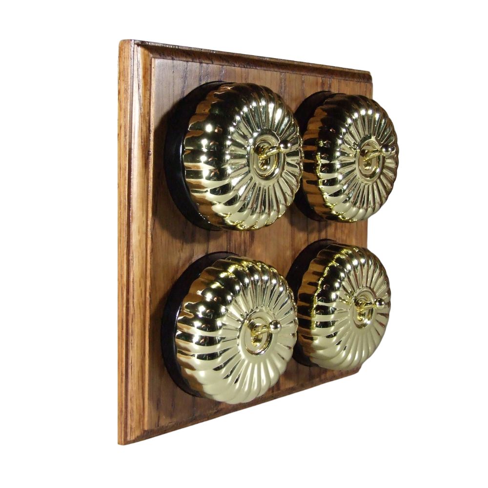 Switch to Wood's Dolly Light Switch Fluted Dome - 4 Gang Horizontal Polished Brass in Medium Oak 