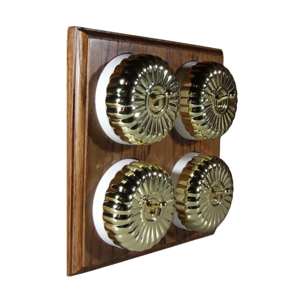 Switch to Wood's Dolly Light Switch Fluted Dome - 4 Gang Horizontal Polished Brass in Medium Oak 