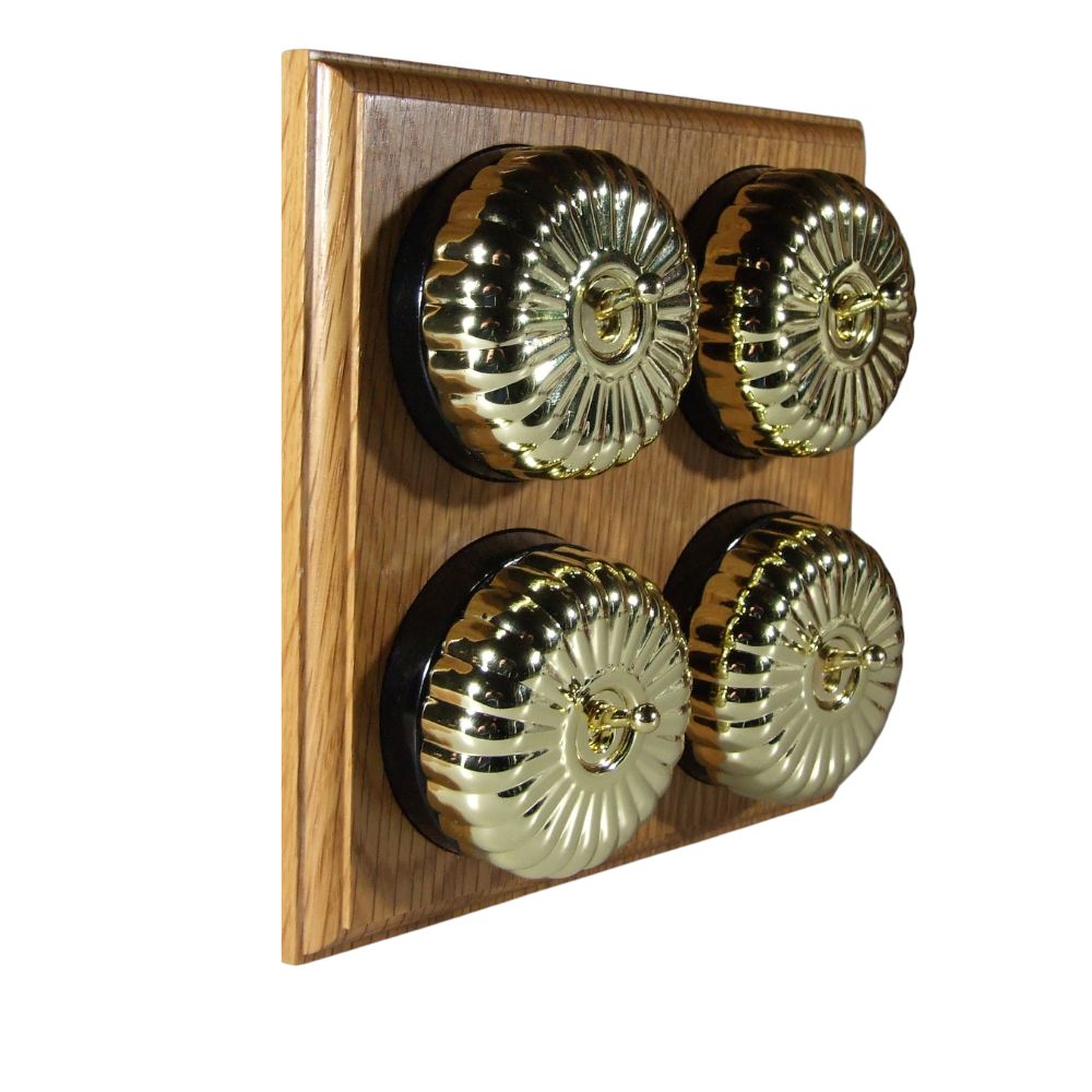 Switch to Wood's Dolly Light Switch Fluted Dome - 4 Gang Horizontal Polished Brass in Light Oak
