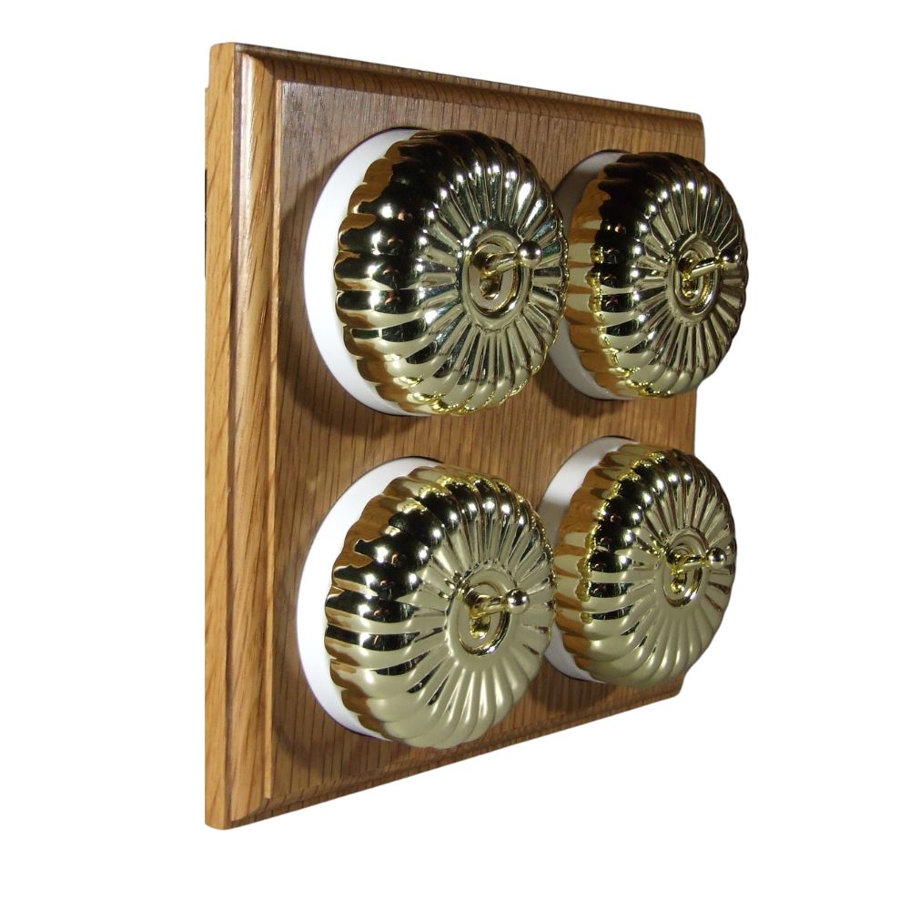 Switch to Wood's Dolly Light Switch Fluted Dome - 4 Gang Horizontal Polished Brass in Light Oak