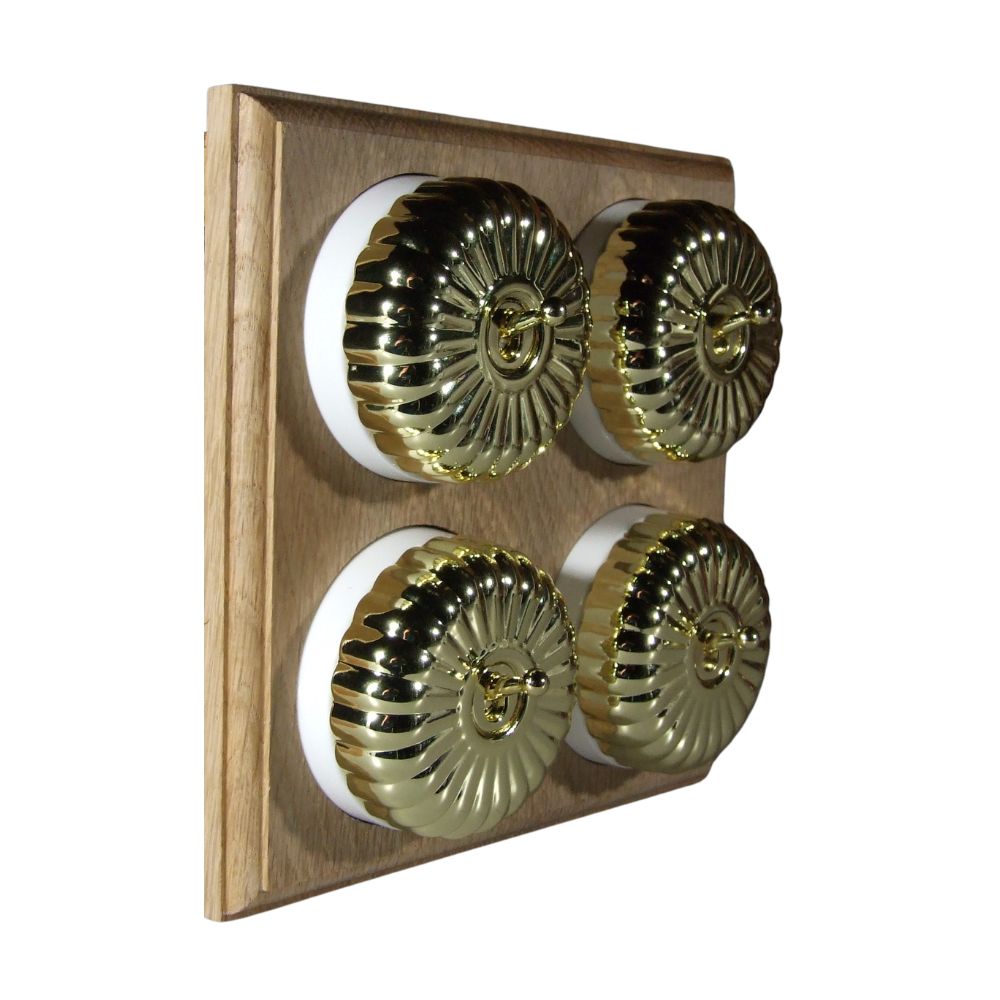 Switch to Wood's Dolly Light Switch Fluted Dome - 4 Gang Horizontal Polished Brass in Unfinished Oak