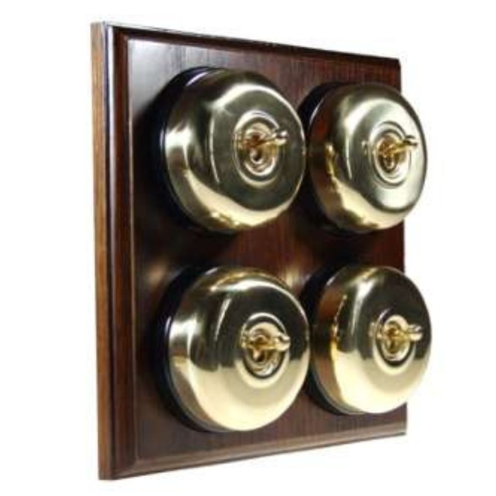 Switch to Wood's Dolly Light Switch Smooth Dome - 4 Gang Horizontal Polished Brass in Dark Oak