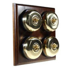 Switch to Wood's Dolly Light Switch Smooth Dome - 4 Gang Horizontal Polished Brass in Dark Oak