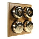 Switch to Wood's Dolly Light Switch Smooth Dome - 4 Gang Horizontal Polished Brass in Light Oak