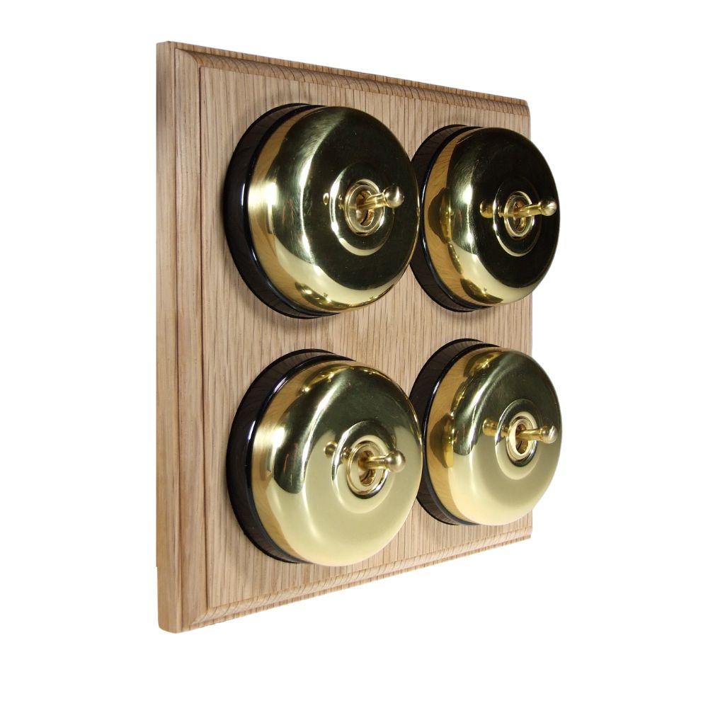 Switch to Wood's Dolly Light Switch Smooth Dome - 4 Gang Horizontal Polished Brass in Unfinished Oak