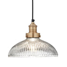 Industrial-style pendant light with a glass dome with a brass holder.