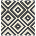 Geometric tile design with interlocking black and warm white diamond patterns for a bold, modern look. 
