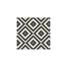 Geometric tile design with interlocking black, warm white and blue diamond patterns for a bold, modern look. 